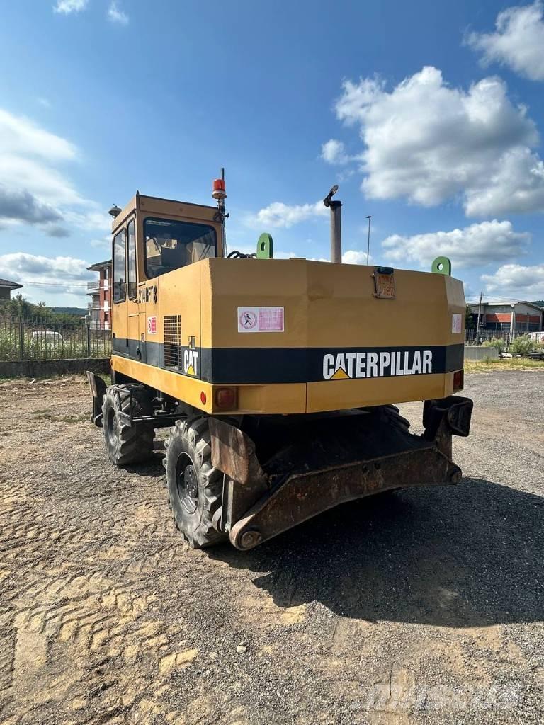 CAT 214 Колёсные экскаваторы