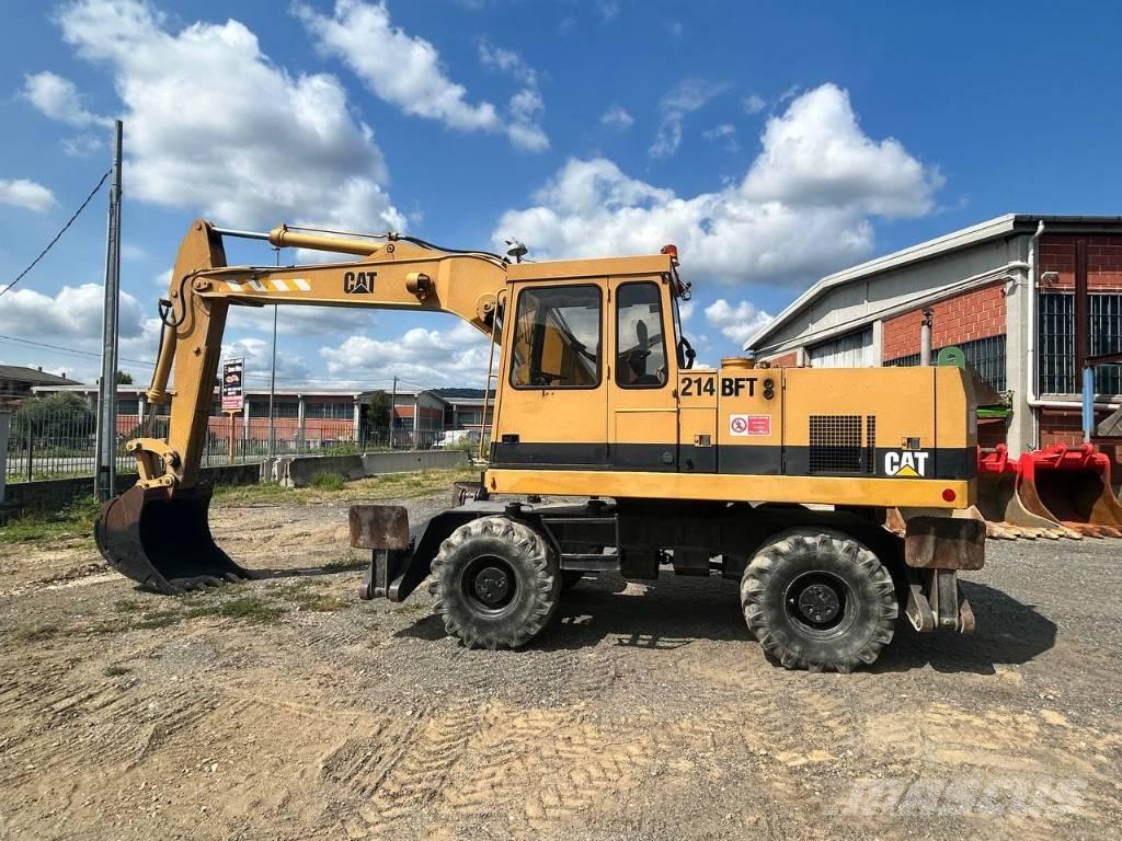CAT 214 Колёсные экскаваторы
