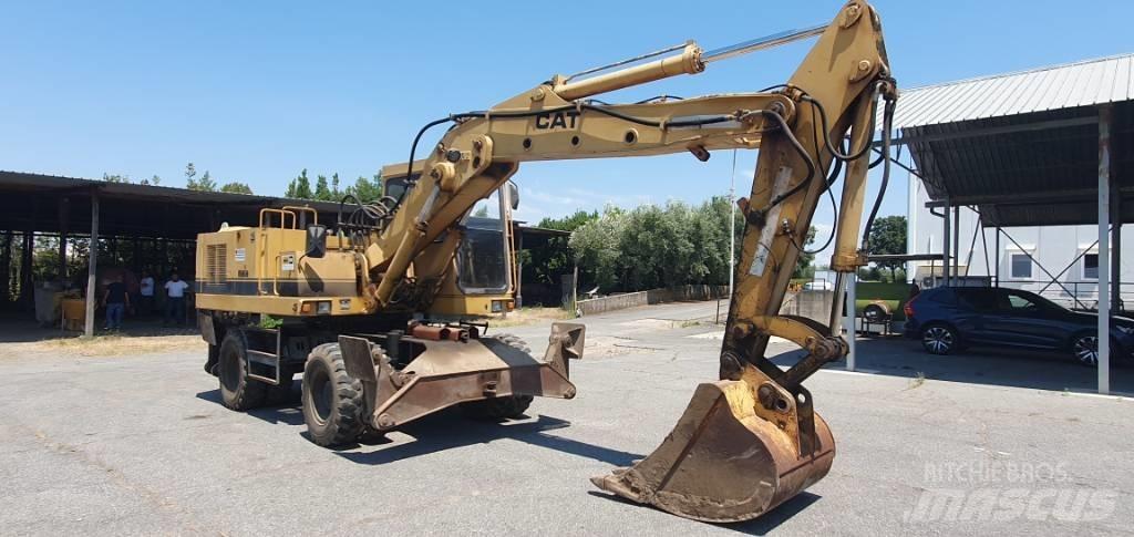 CAT 214 B Колёсные экскаваторы