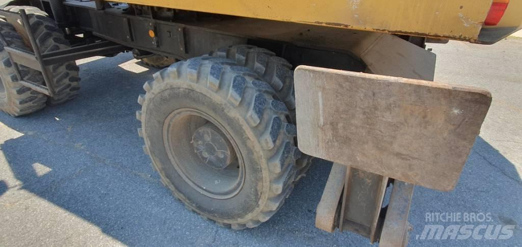 CAT 214 B Колёсные экскаваторы