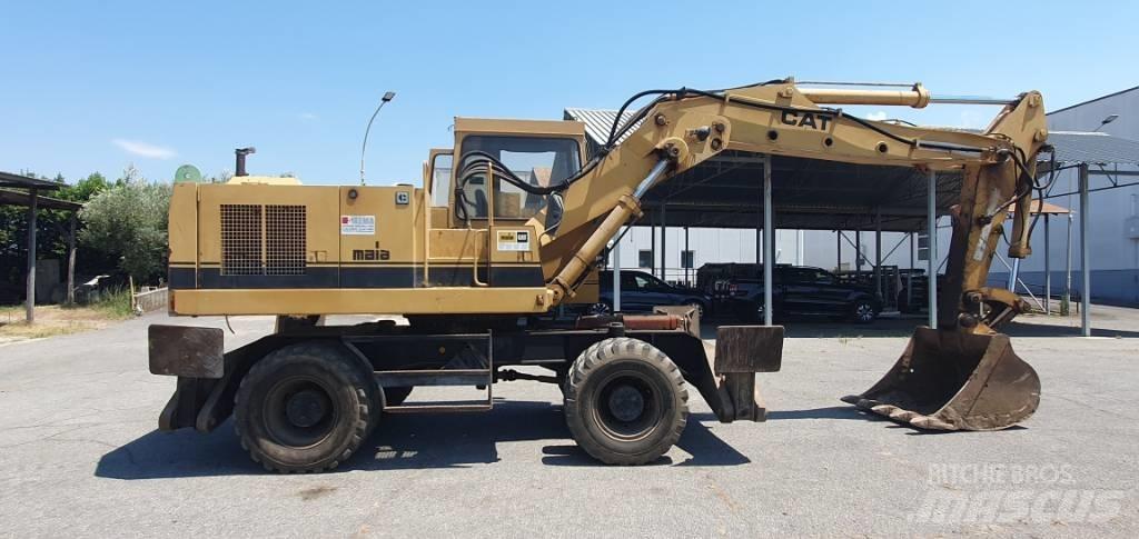 CAT 214 B Колёсные экскаваторы
