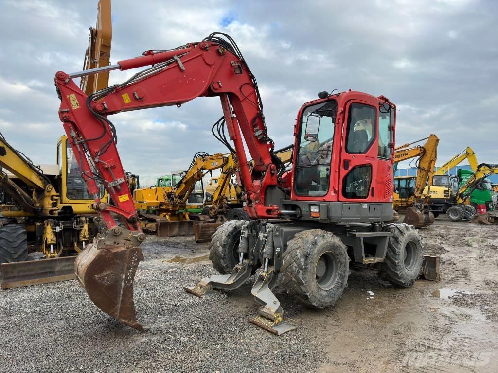 Komatsu PW98MR-8 Колёсные экскаваторы