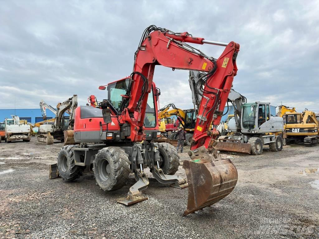 Komatsu PW98MR-8 Колёсные экскаваторы