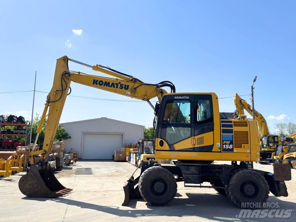 Komatsu PW 158-11 Колёсные экскаваторы