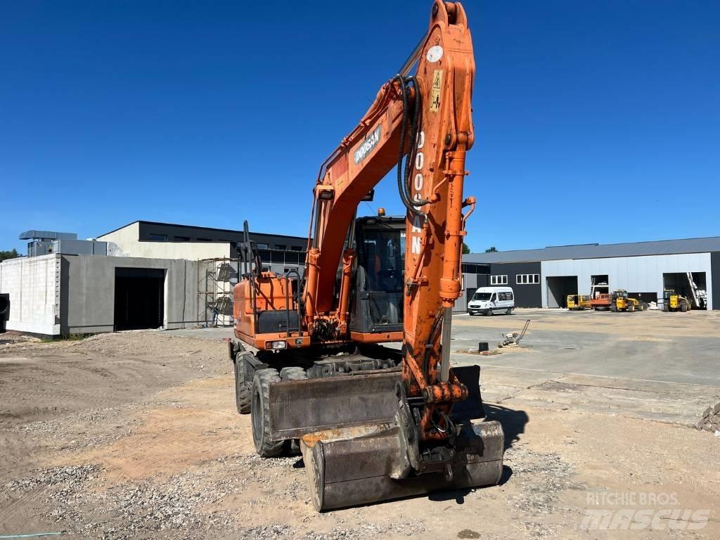 Doosan DX 140 W Колёсные экскаваторы