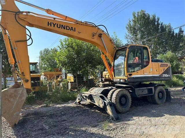 Hyundai 210W Колёсные экскаваторы