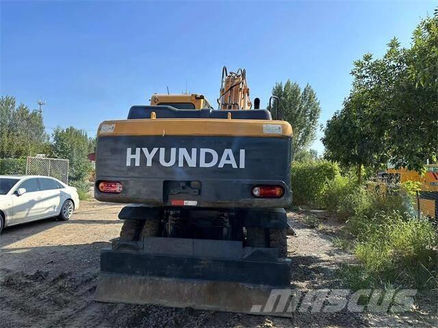 Hyundai 210W Колёсные экскаваторы