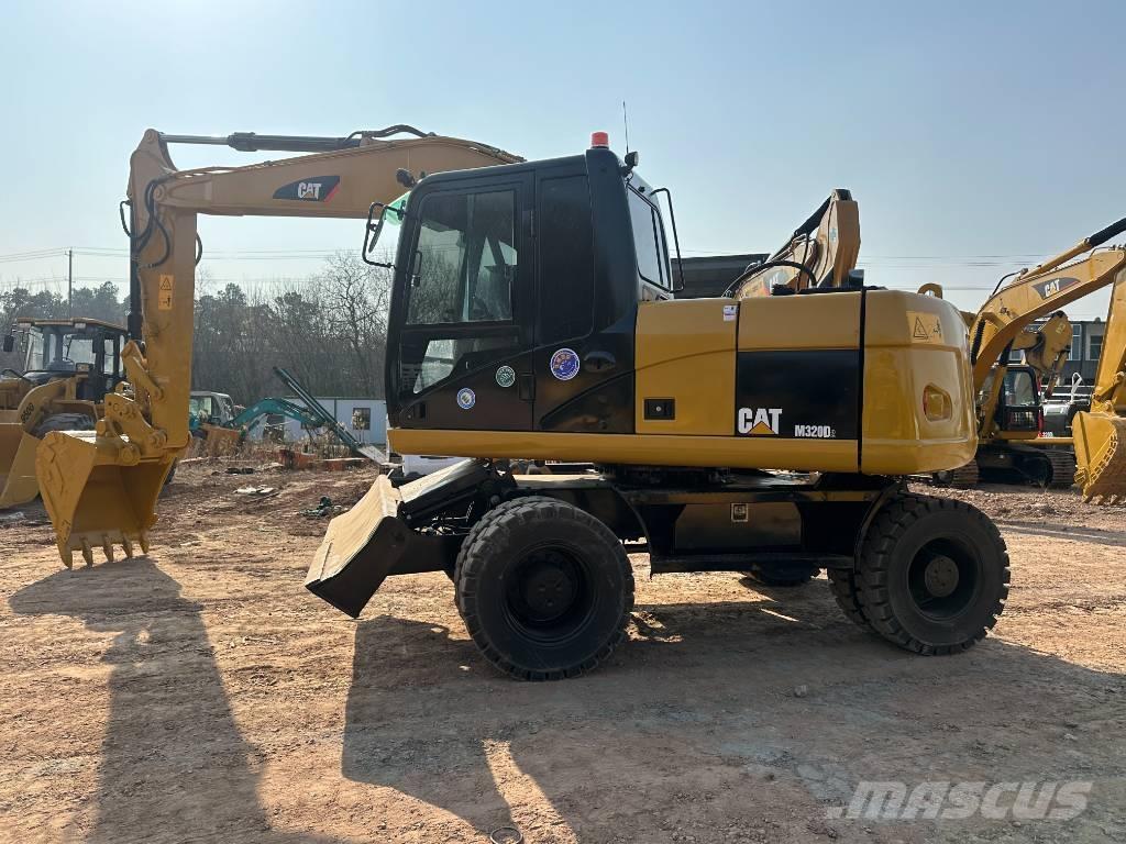 CAT M 320D Колёсные экскаваторы