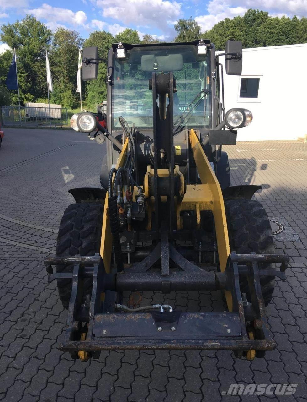 New Holland W50c Фронтальные погрузчики