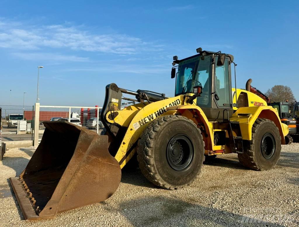 New Holland W 230 C Фронтальные погрузчики