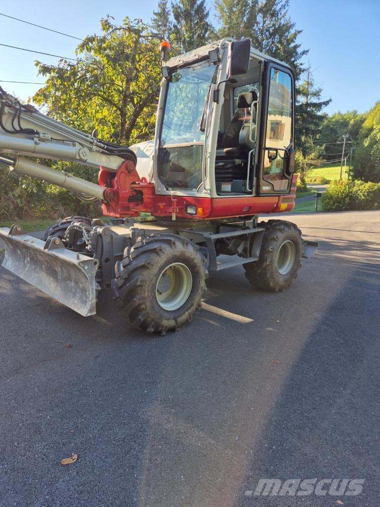 Takeuchi TB 295 W Колёсные экскаваторы