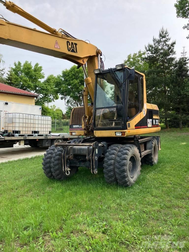 CAT M 312 Колёсные экскаваторы