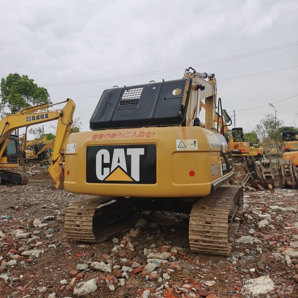 CAT 323DL Гусеничные экскаваторы