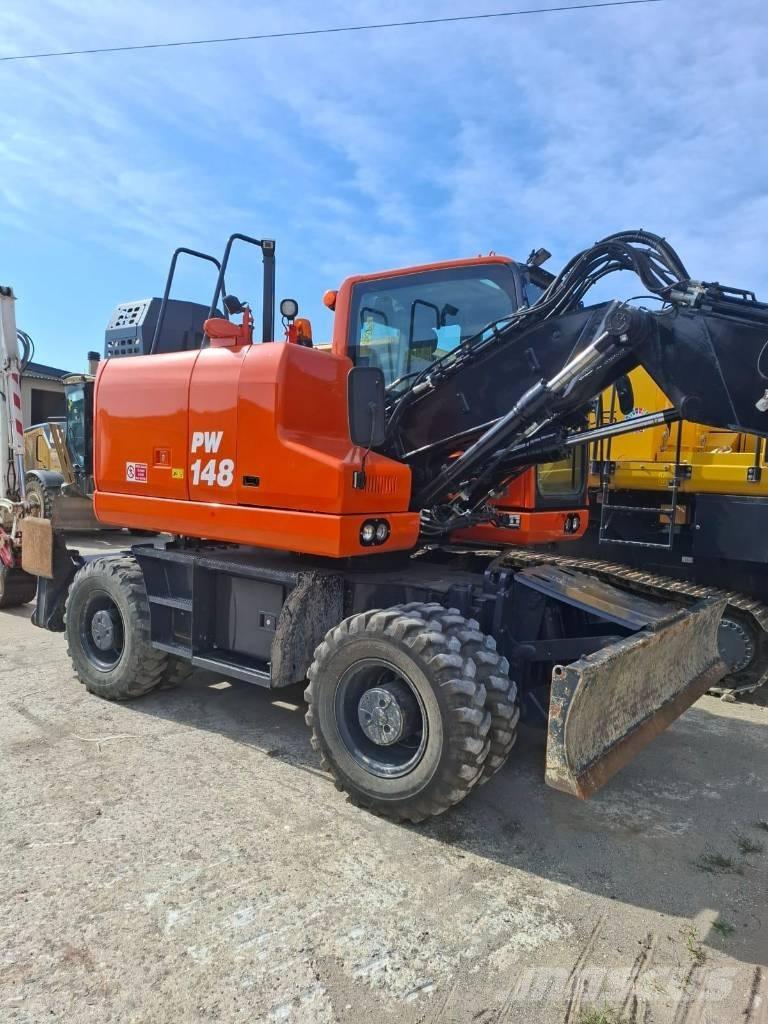 Komatsu PW 148-11 Колёсные экскаваторы