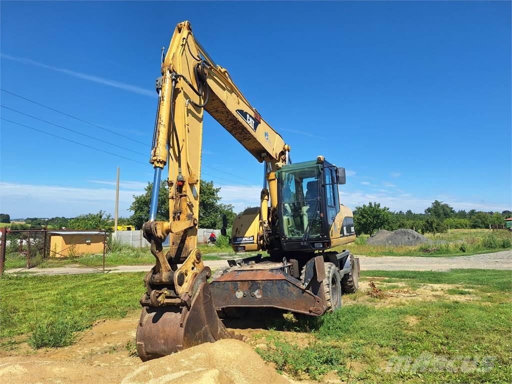 CAT M 318 C 4X4 Строительная техника - Другие