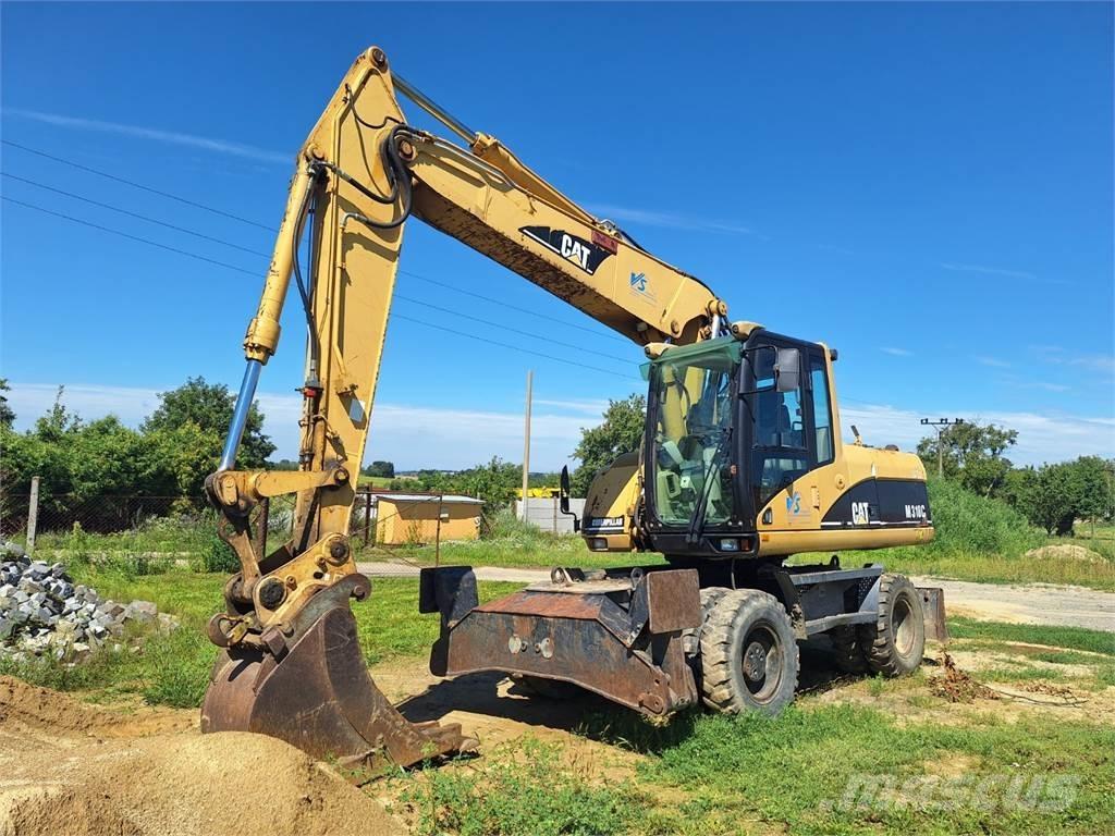 CAT M 318 C 4X4 Строительная техника - Другие