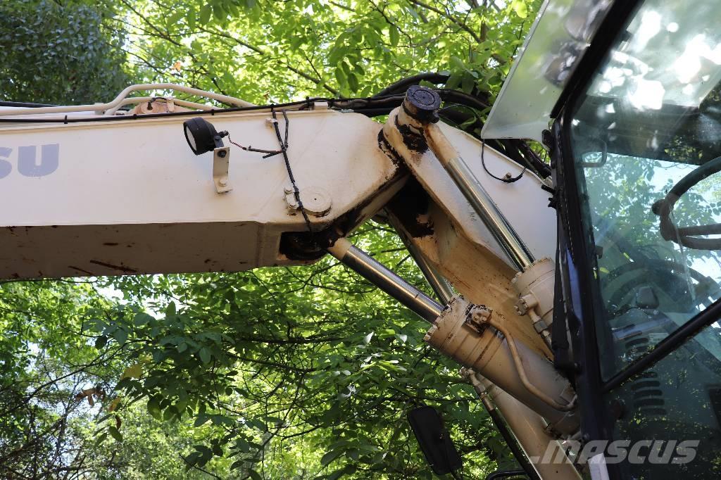 Komatsu PW 140-7 Экскаваторы-погрузчики