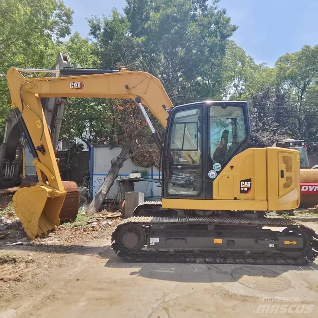 CAT 310 Малые экскаваторы 7т-12т