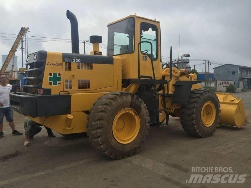 Komatsu WA 320 Экскаваторы-погрузчики