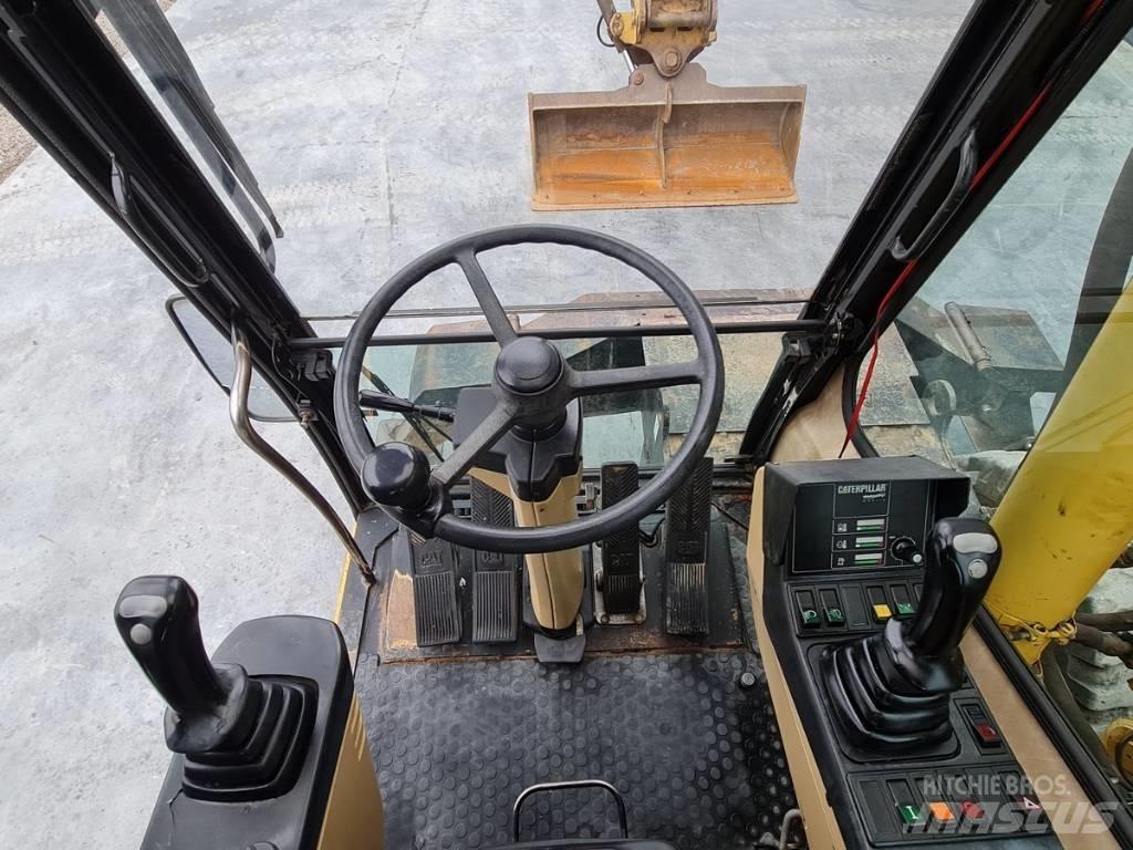 CAT M 312 Колёсные экскаваторы