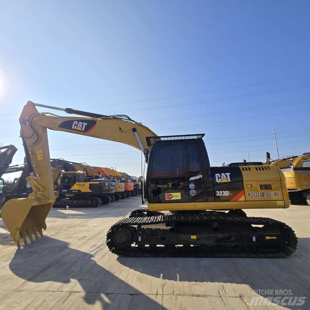 CAT 323 D L Малые экскаваторы 7т-12т
