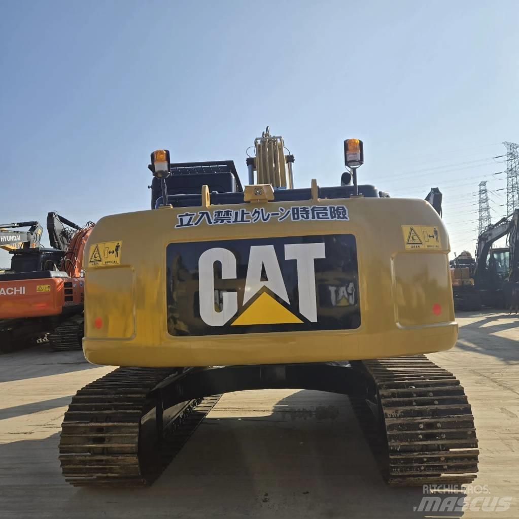 CAT 323 D L Малые экскаваторы 7т-12т