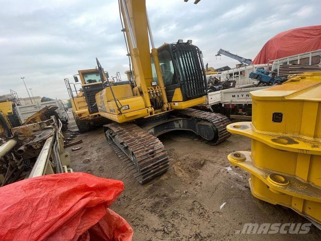 Komatsu PC210-10MO Гусеничные экскаваторы