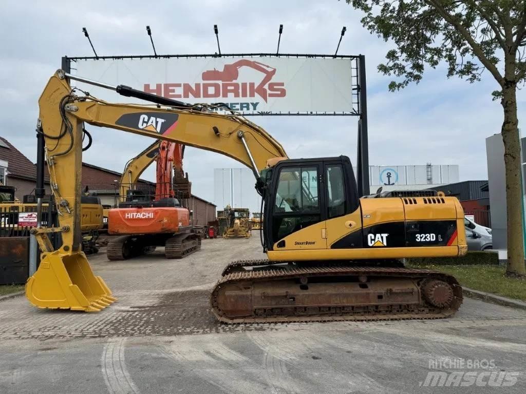 CAT 323DL (320DL) Гусеничные экскаваторы