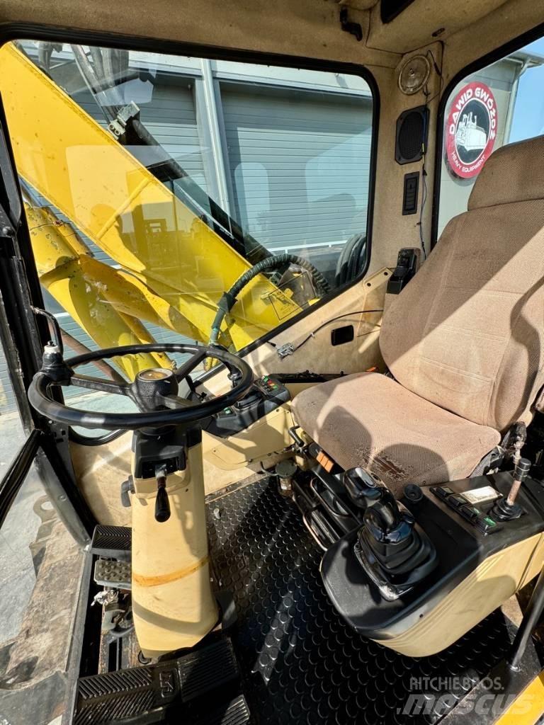 CAT M 312 Колёсные экскаваторы