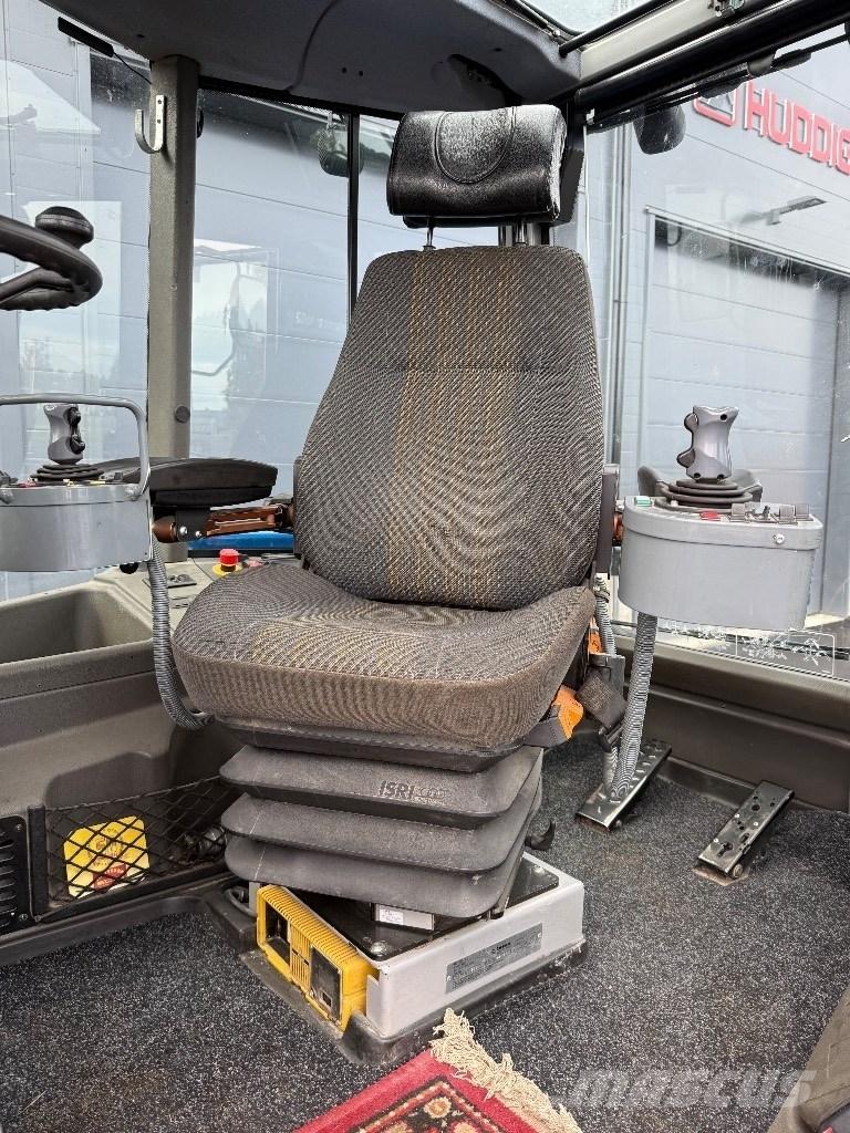 Huddig 1260 B Экскаваторы-погрузчики