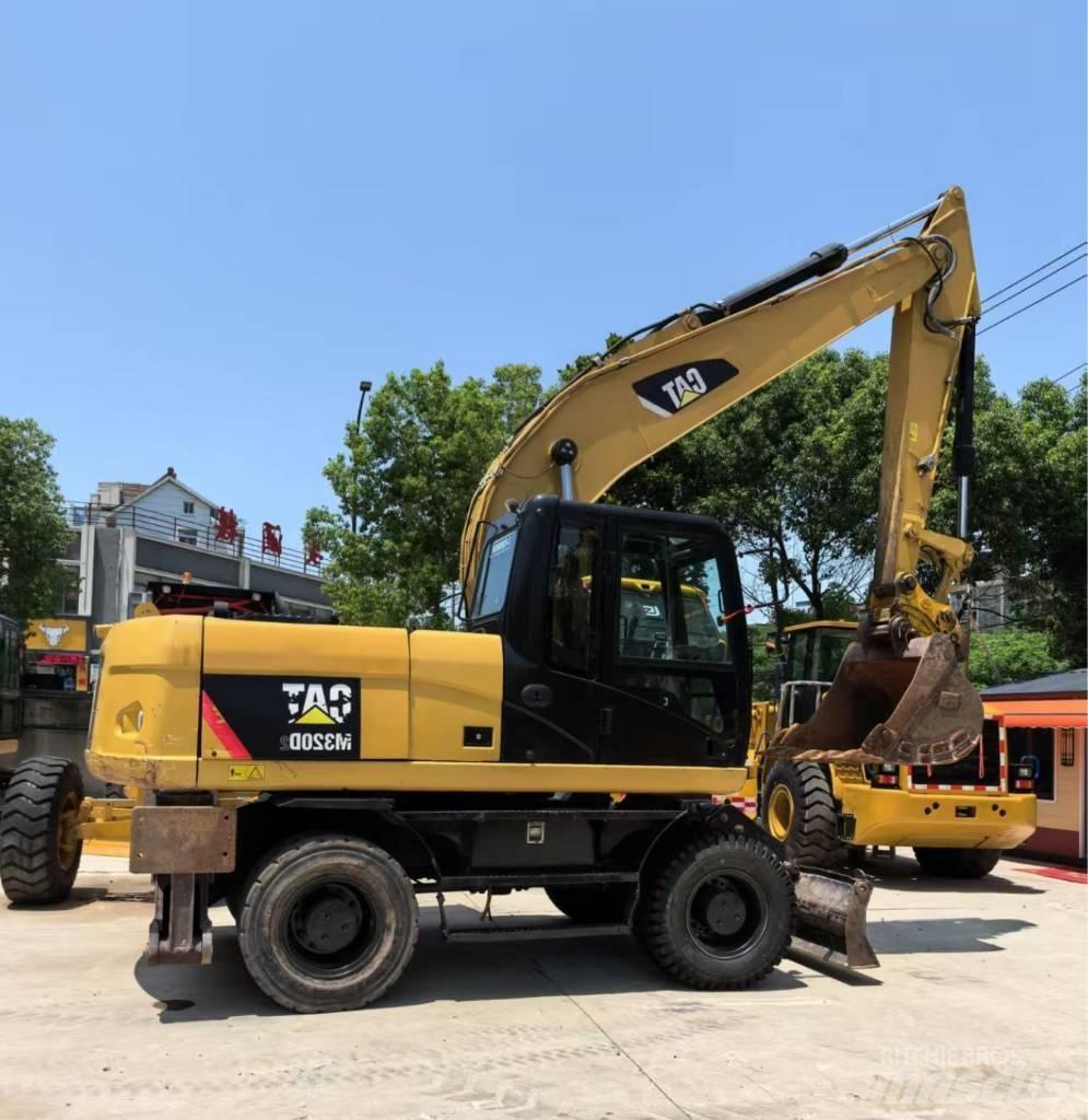 CAT M 320 Колёсные экскаваторы
