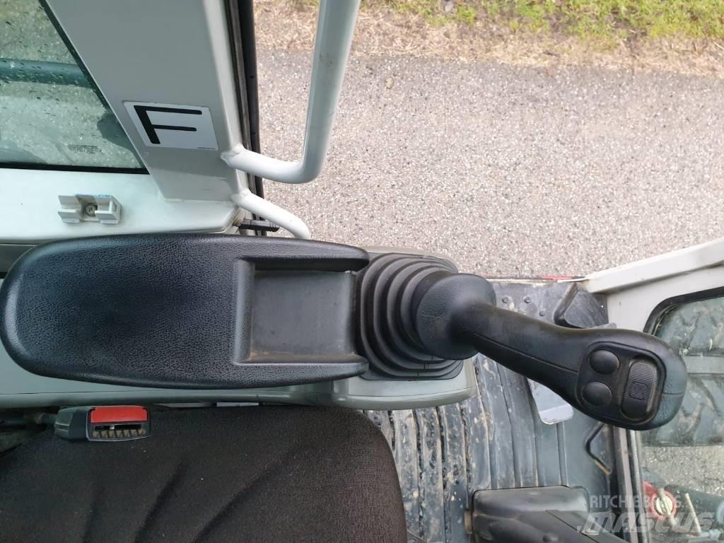 Takeuchi TB 295 W Колёсные экскаваторы