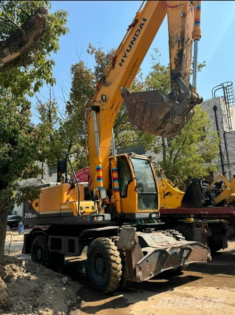 Hyundai 210W-9 Колёсные экскаваторы