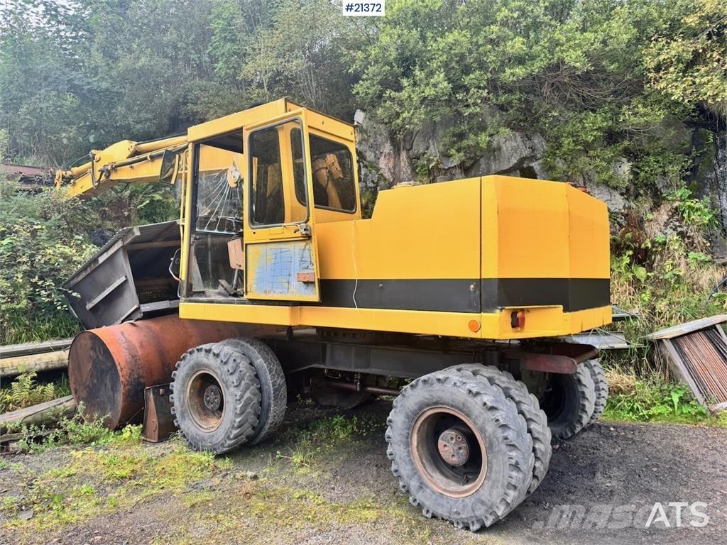 CAT 212B Колёсные экскаваторы