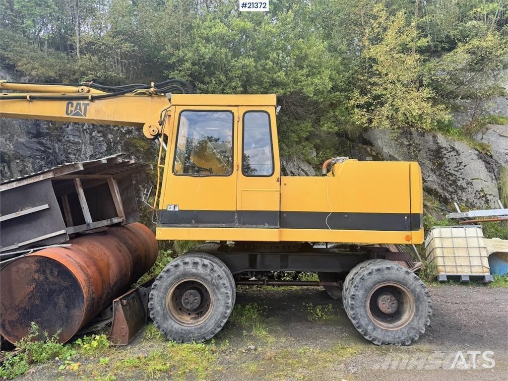 CAT 212B Колёсные экскаваторы