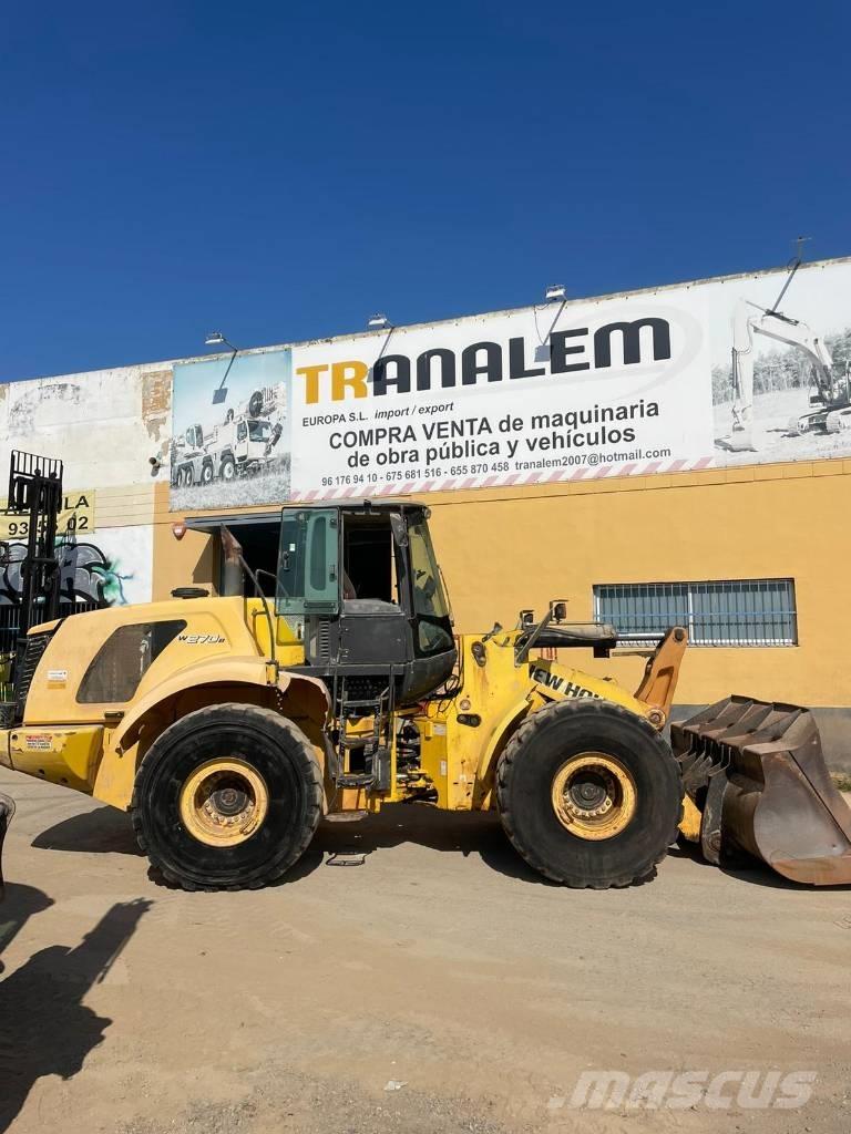 New Holland W 270 B Фронтальные погрузчики