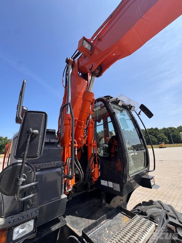 Hitachi 140W Колёсные экскаваторы