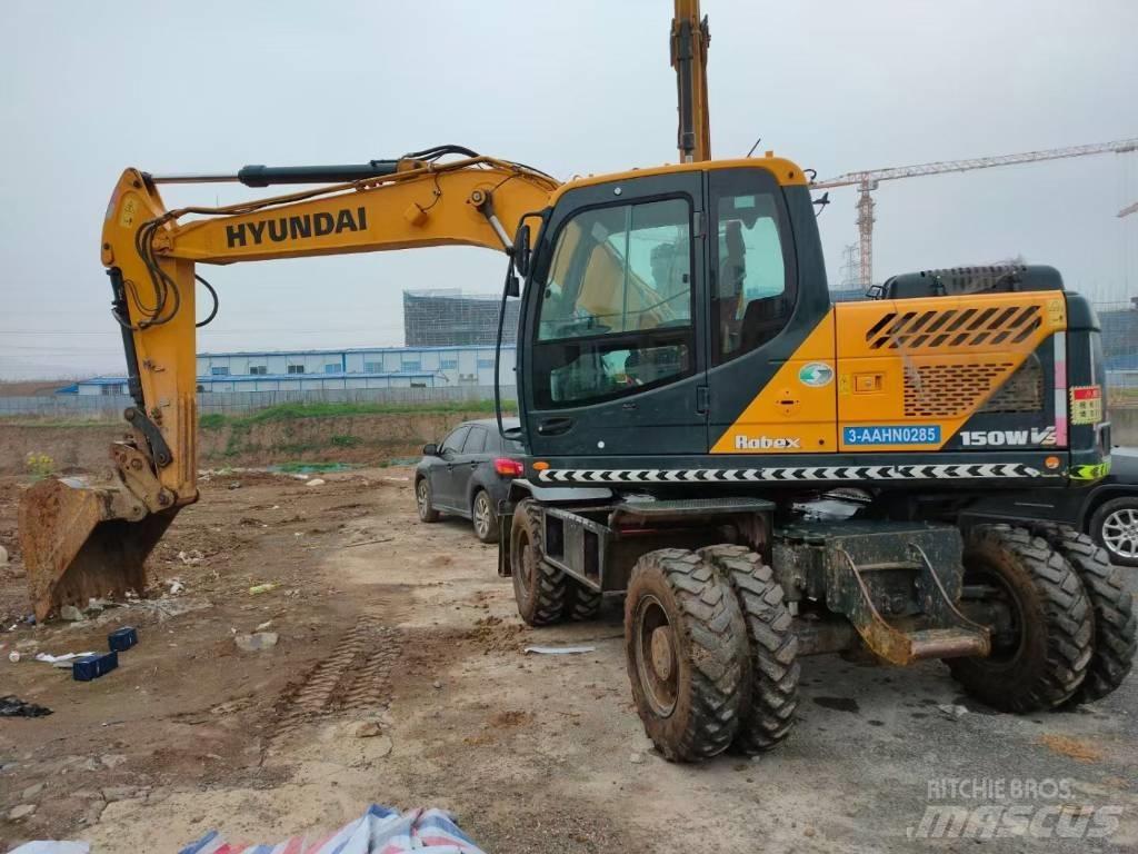 Hyundai 210W Колёсные экскаваторы