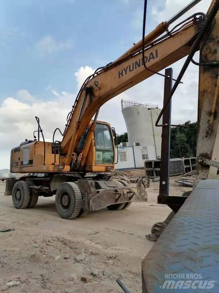 Hyundai 210W Колёсные экскаваторы