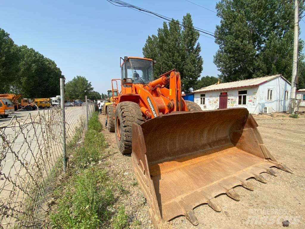 Doosan DL503 Экскаваторы-погрузчики