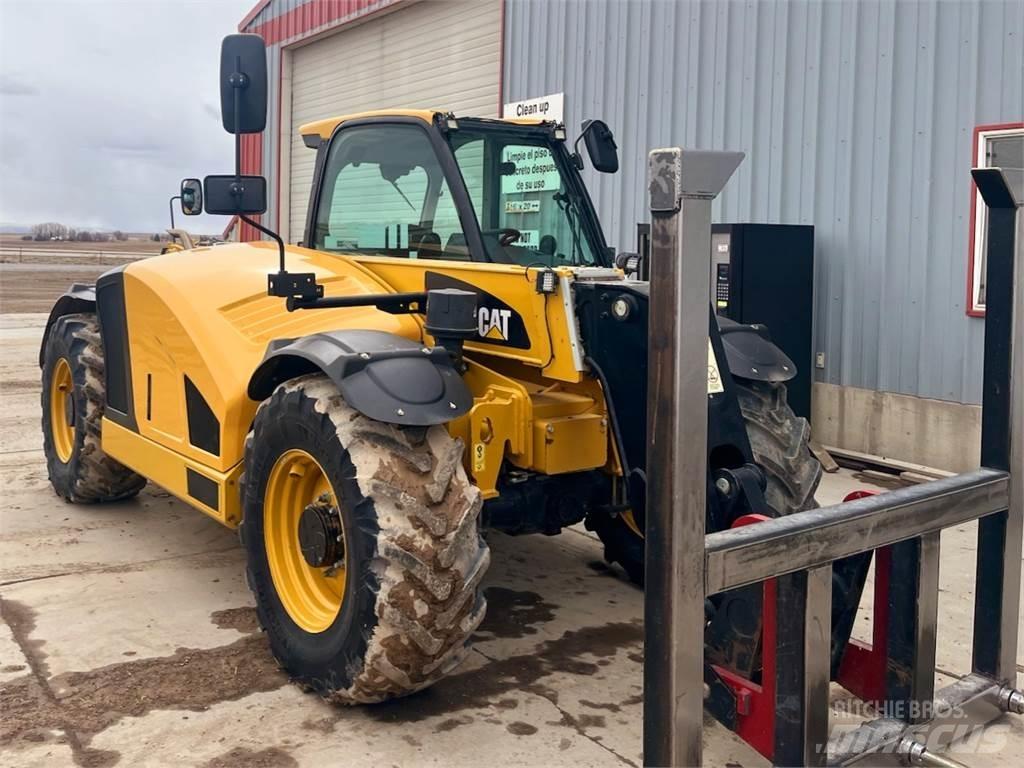 CAT TH408D Строительная техника - Другие