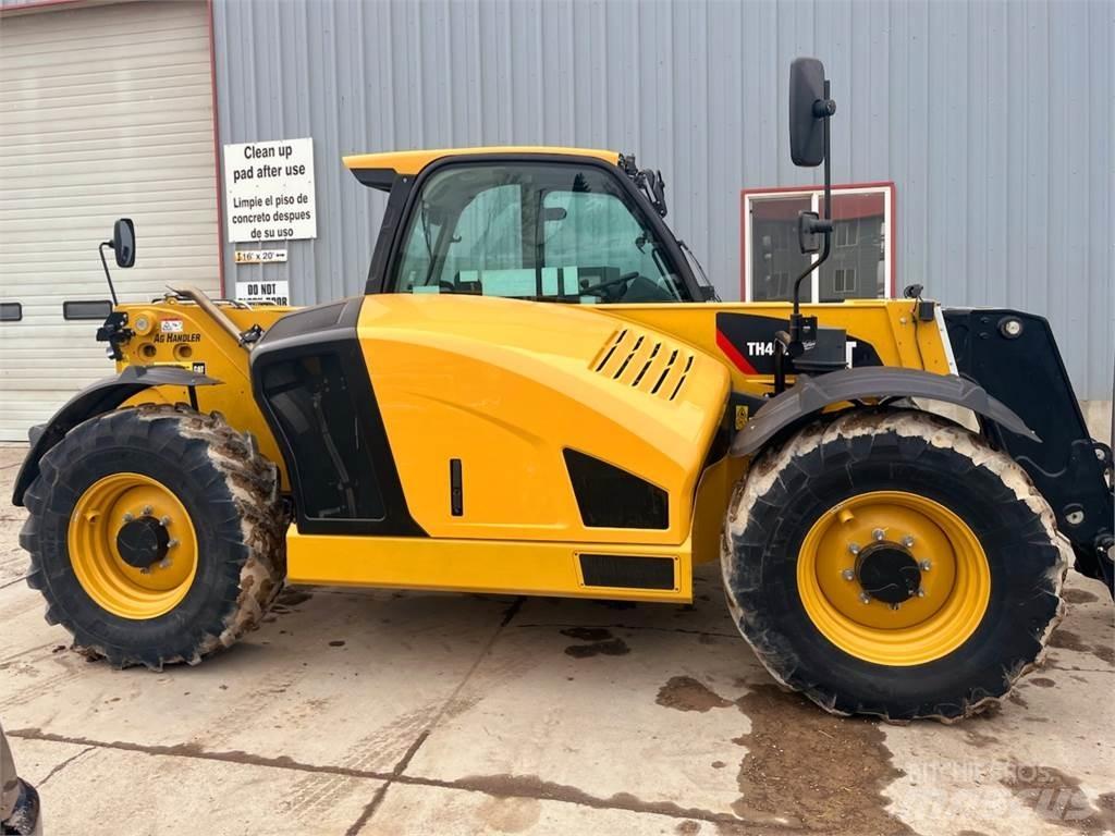 CAT TH408D Строительная техника - Другие