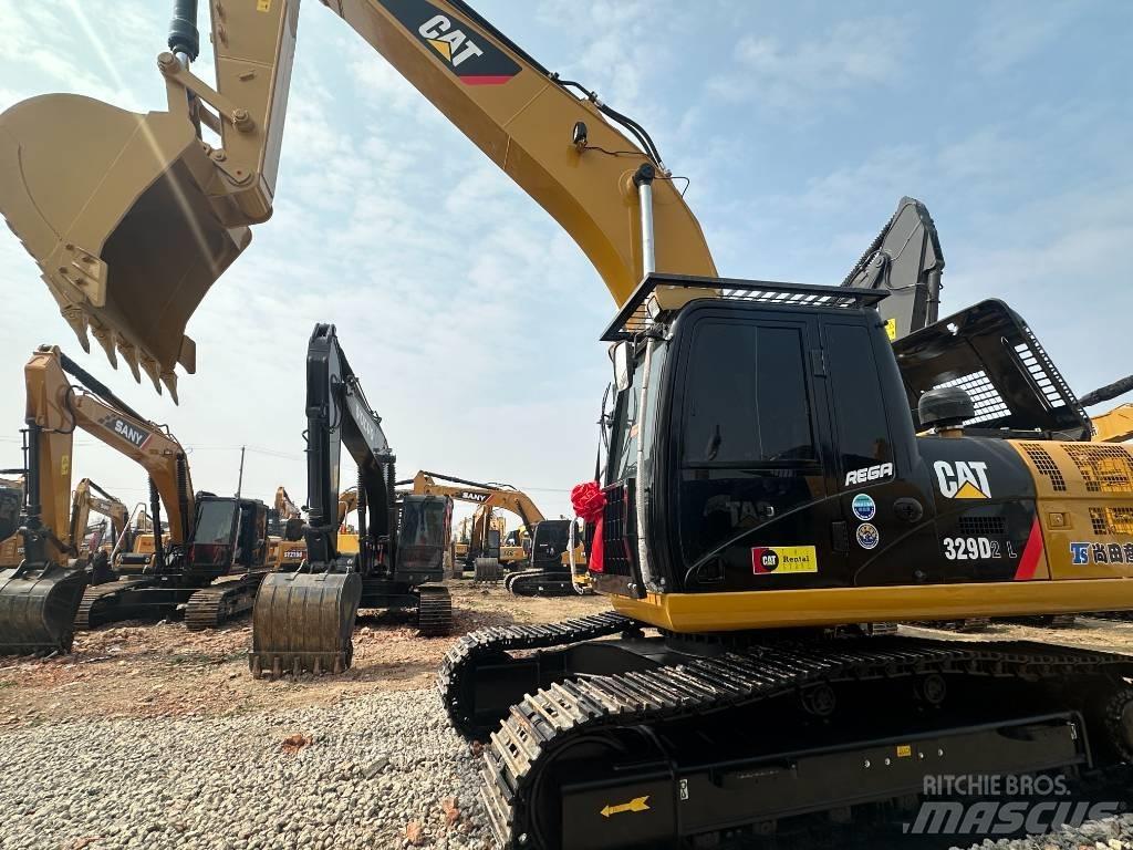 CAT 329 D2L Малые экскаваторы 7т-12т