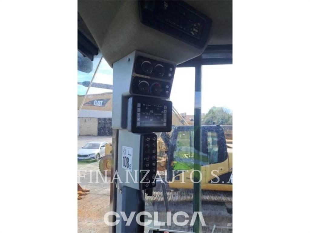 CAT 966M Фронтальные погрузчики