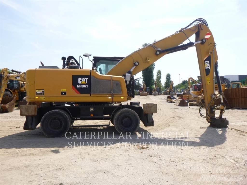 CAT MH3022-06 Колёсные экскаваторы