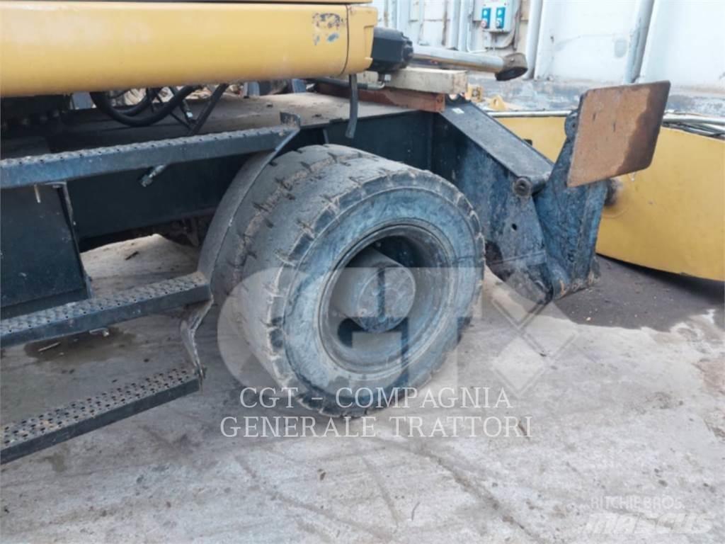 CAT MH3024 Колёсные экскаваторы