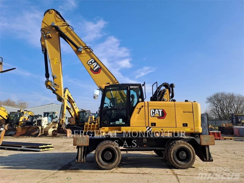 CAT MH3024 Колёсные экскаваторы
