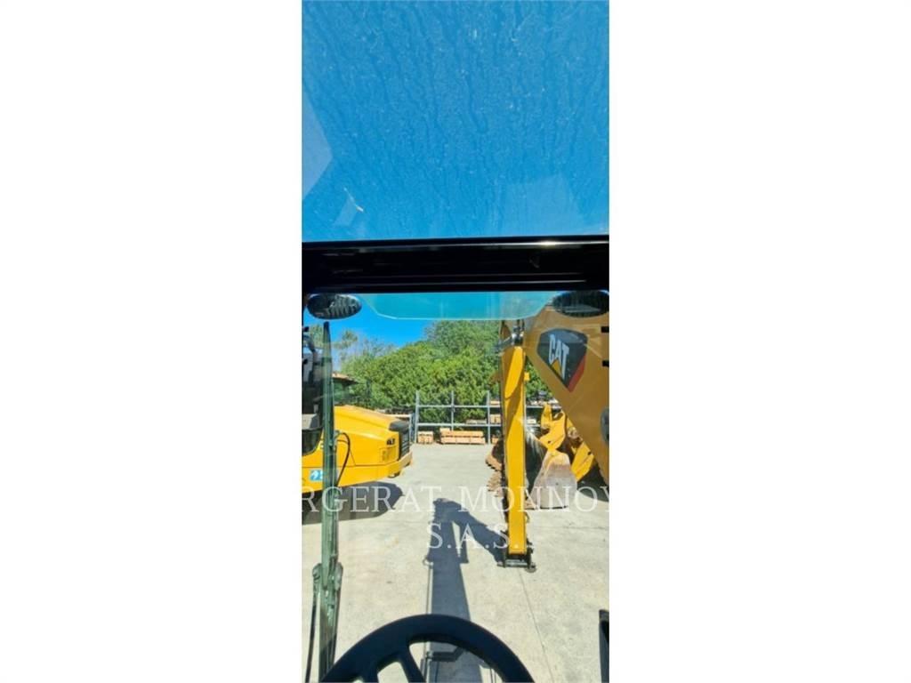CAT MH3024-06 Колёсные экскаваторы