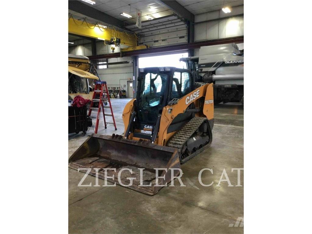 New Holland TR270B Гусеничные фронтальные погрузчики