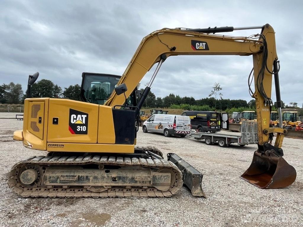 CAT 310 Малые экскаваторы 7т-12т